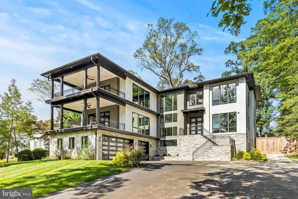 a view of a big room with a big yard and large trees