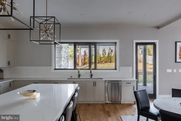 a kitchen with a stove and a sink