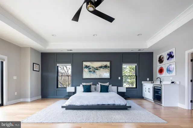 a very nice looking room with a ceiling fan and window