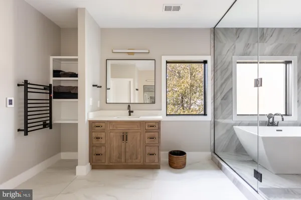 a bedroom with a bed and a walk in closet