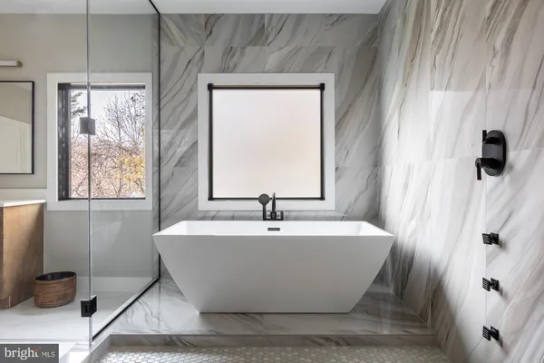a bathroom with a sink toilet and mirror