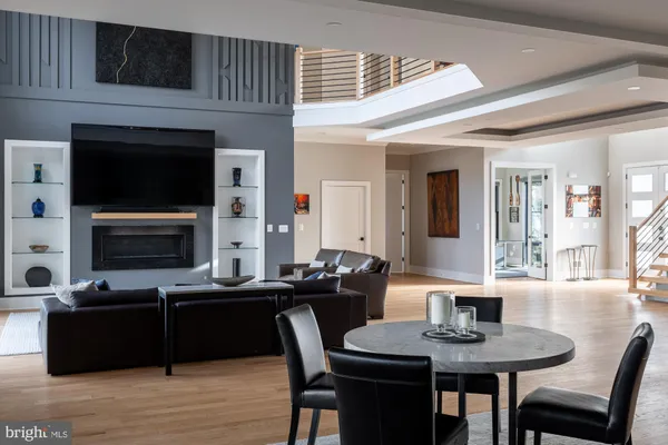 a kitchen with stainless steel appliances granite countertop a sink a stove a refrigerator and cabinets