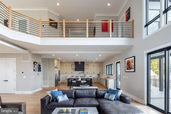 a kitchen with a table chairs sink and cabinets