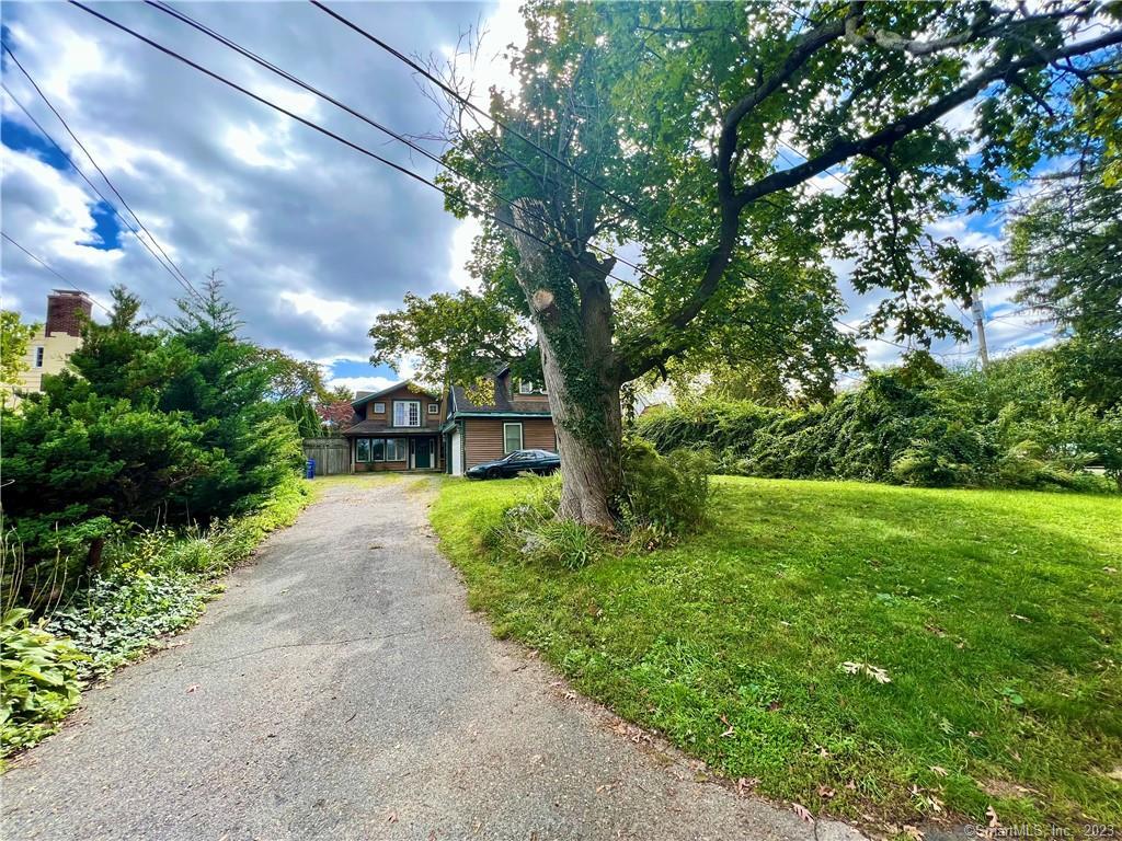 17 Shorefront Park Norwalk, CT 06854 - Photo 1 of 1 a view of a yard with plants and a large trees