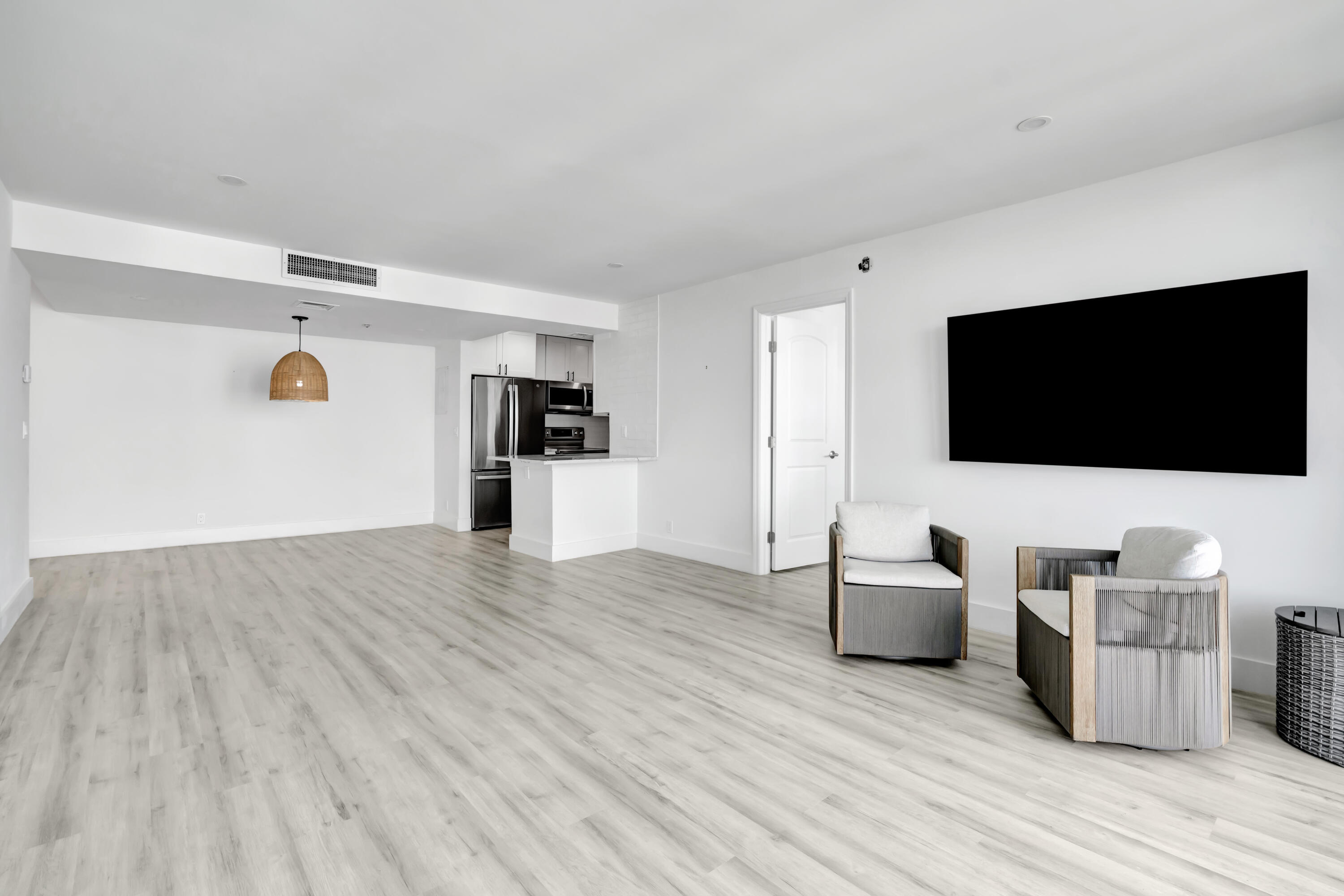 336 Golfview Road, Unit 1104 North Palm Beach, FL 33408 - Photo 11 of 54 a living room with furniture and a flat screen tv