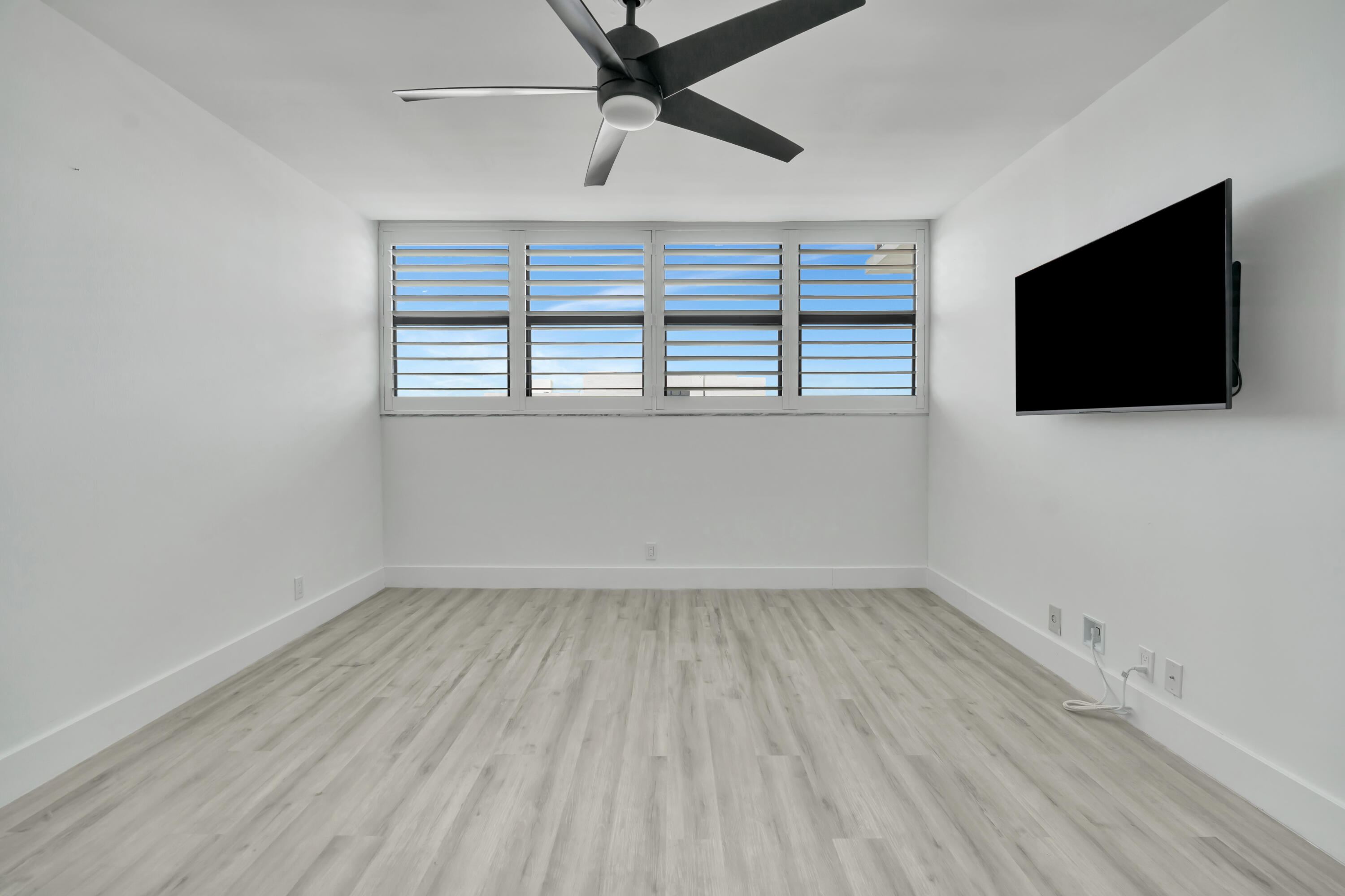 336 Golfview Road, Unit 1104 North Palm Beach, FL 33408 - Photo 20 of 54 wooden floor in an empty room with a window