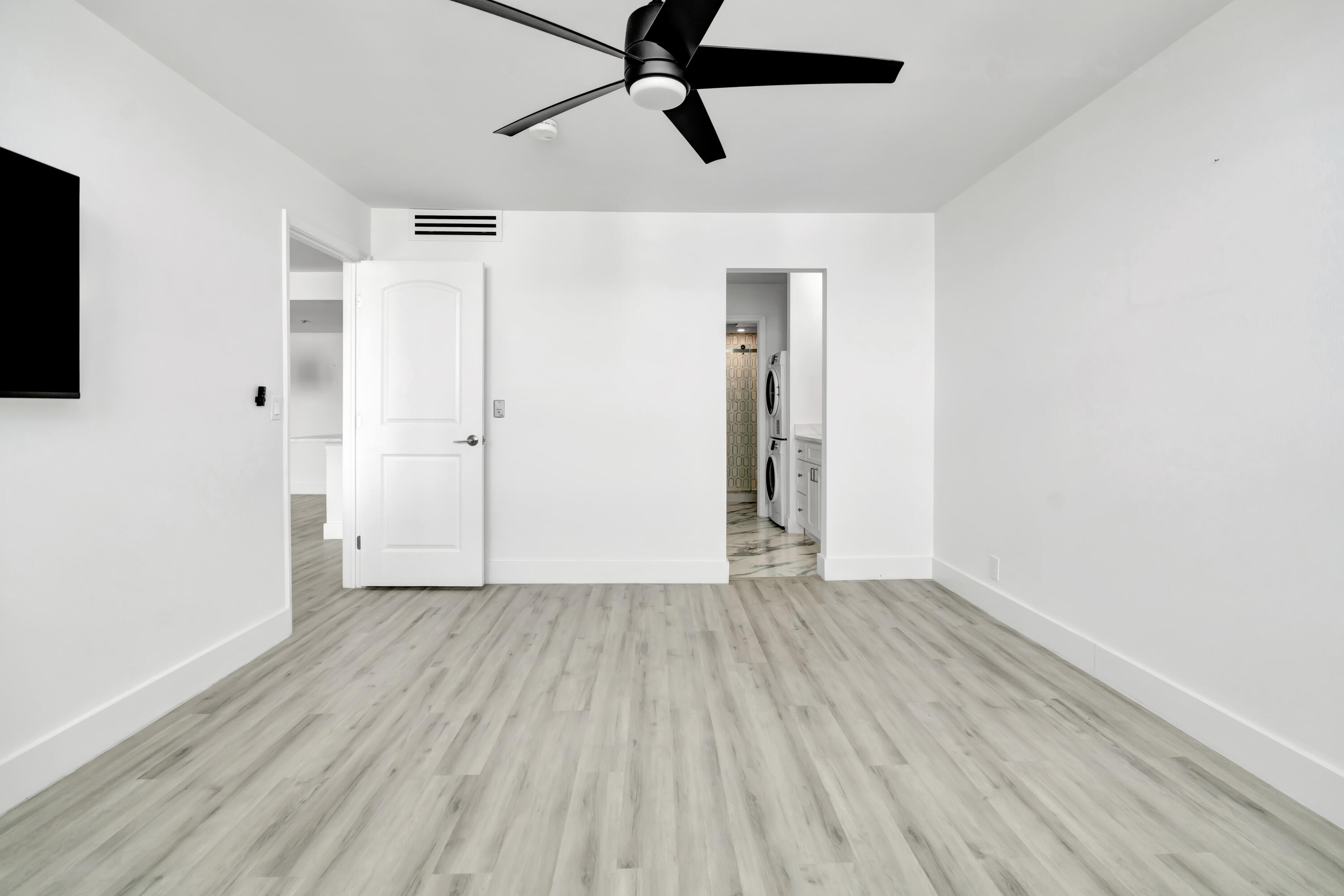 336 Golfview Road, Unit 1104 North Palm Beach, FL 33408 - Photo 23 of 54 a view of an empty room with wooden floor