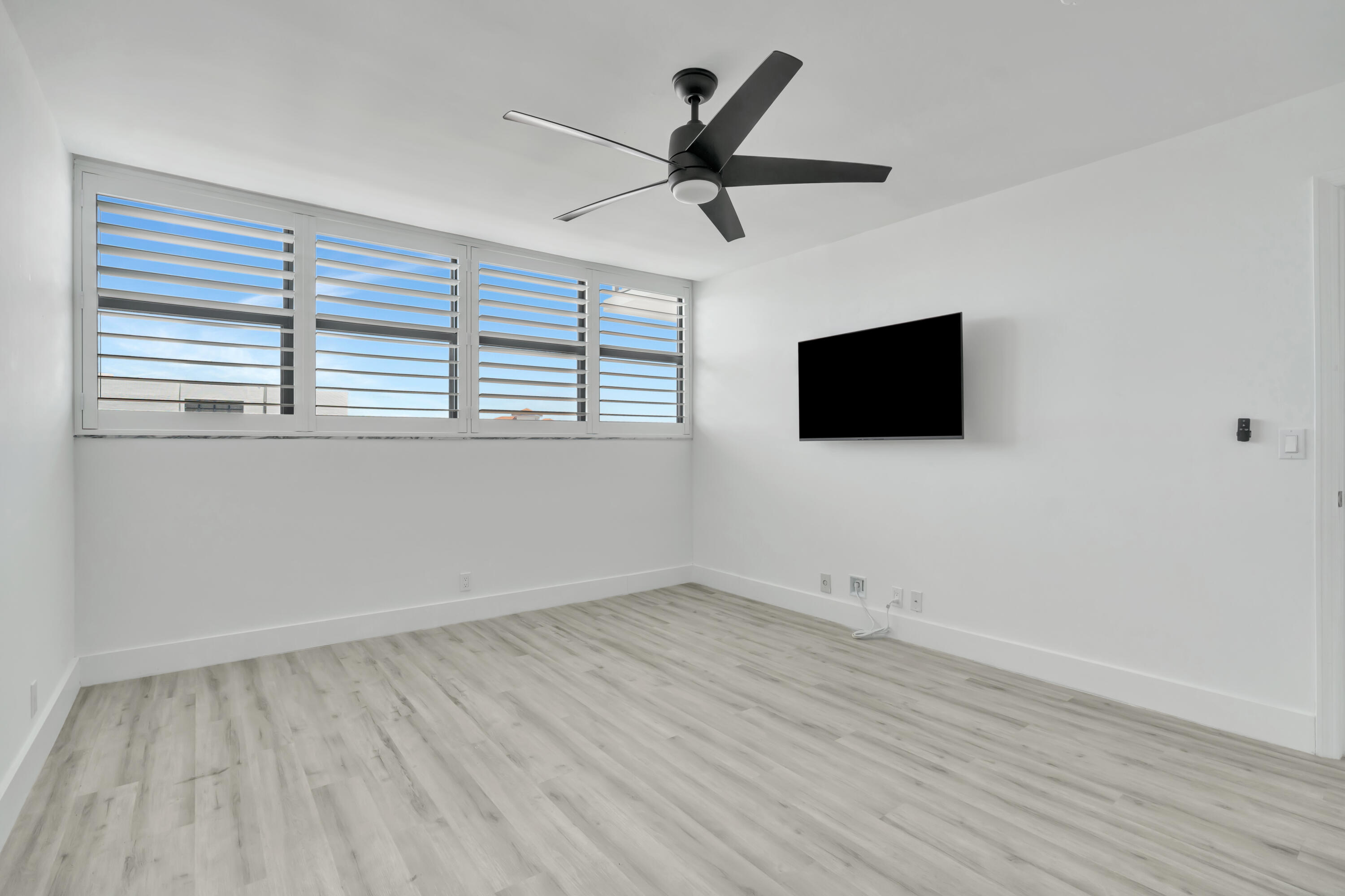 336 Golfview Road, Unit 1104 North Palm Beach, FL 33408 - Photo 30 of 54 wooden floor in an empty room with a window