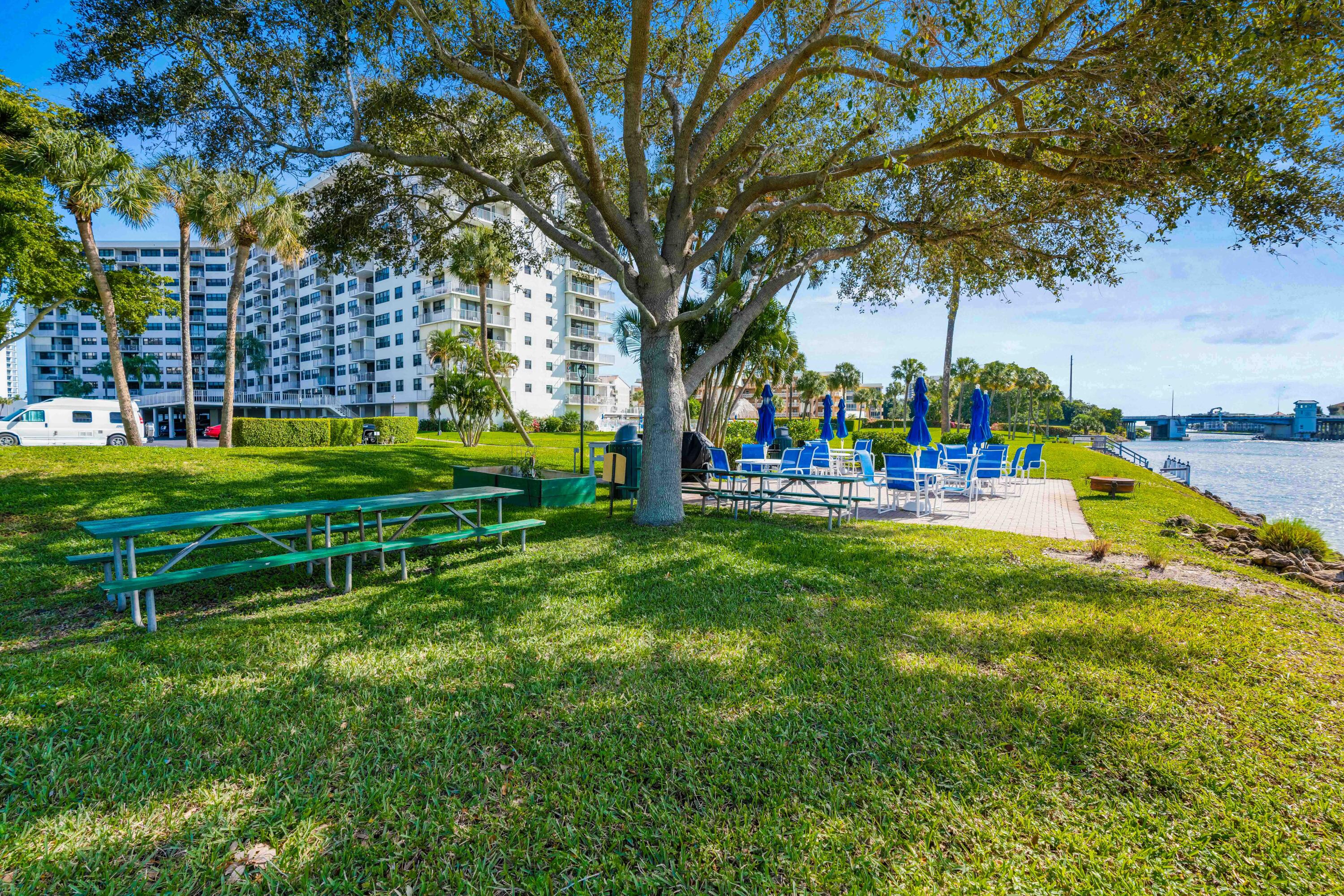 336 Golfview Road, Unit 1104 North Palm Beach, FL 33408 - Photo 40 of 54 a view of a park with large trees