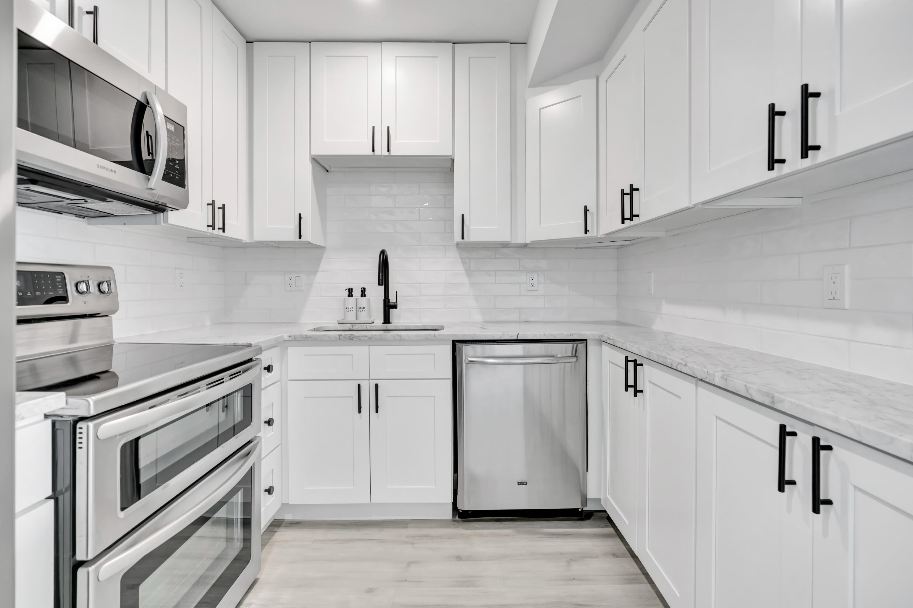 336 Golfview Road, Unit 1104 North Palm Beach, FL 33408 - Photo 8 of 54 a kitchen with stainless steel appliances granite countertop a sink and a stove