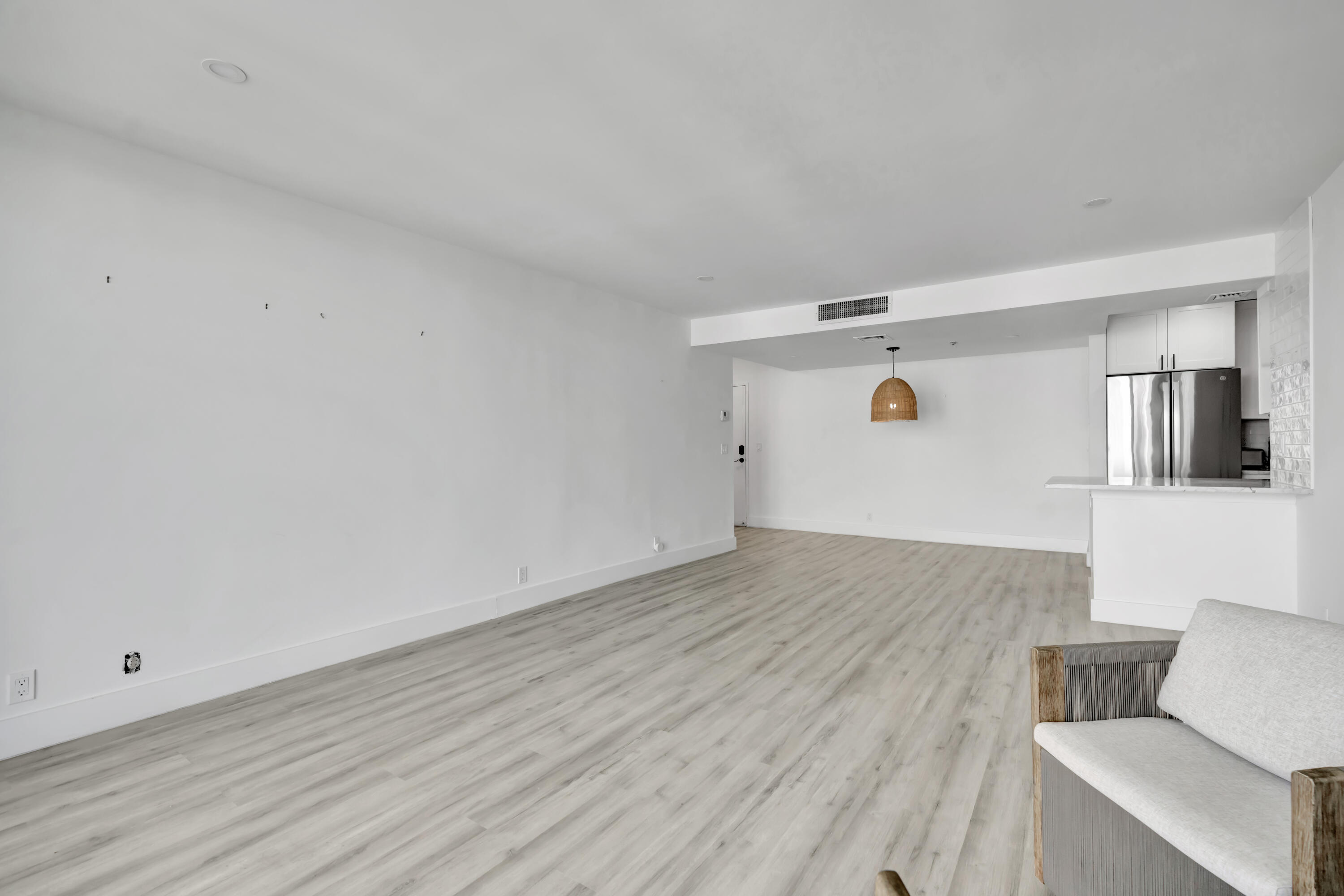 336 Golfview Road, Unit 1104 North Palm Beach, FL 33408 - Photo 10 of 54 a view of livingroom with furniture and wooden floor