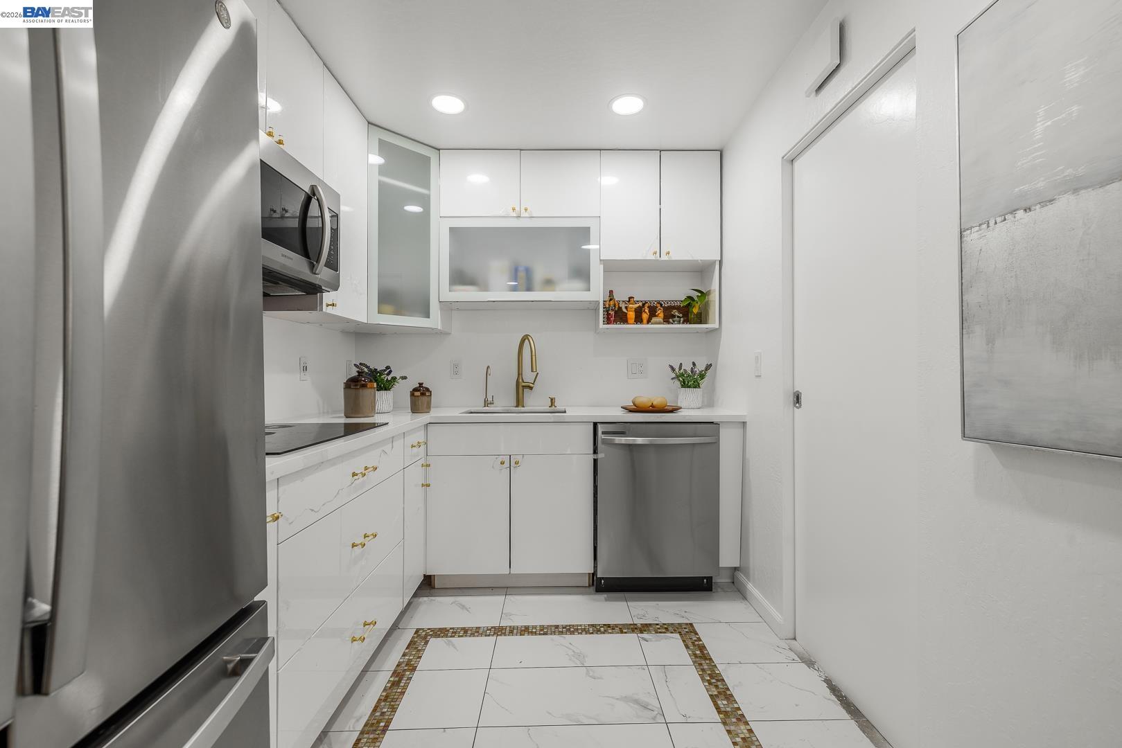 4032 Doane Street Fremont, CA 94538 - Photo 6 of 39 a kitchen with white cabinets stainless steel appliances and a sink
