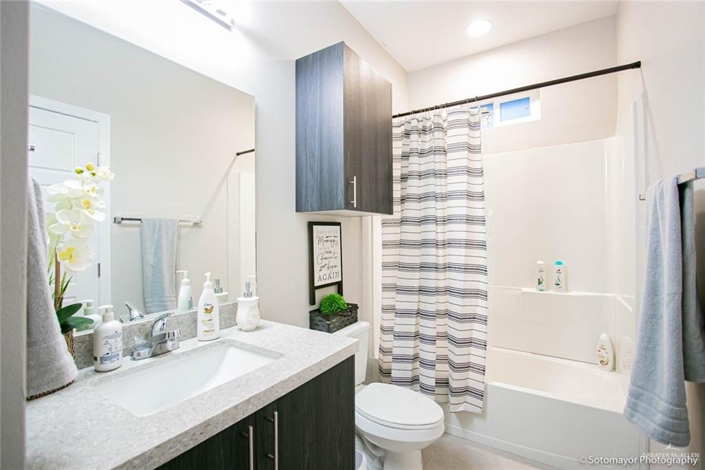 5601 Swallow Avenue, Unit 3 Mission, TX 78573 - Photo 12 of 15 Full bathroom featuring vanity and shower / bathtub combination with curtain