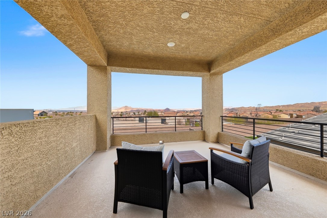 290 Rusty Ridge Lane Henderson, NV 89015 - Photo 18 of 61 Balcony off Primary bedroom w/strip & mountain views