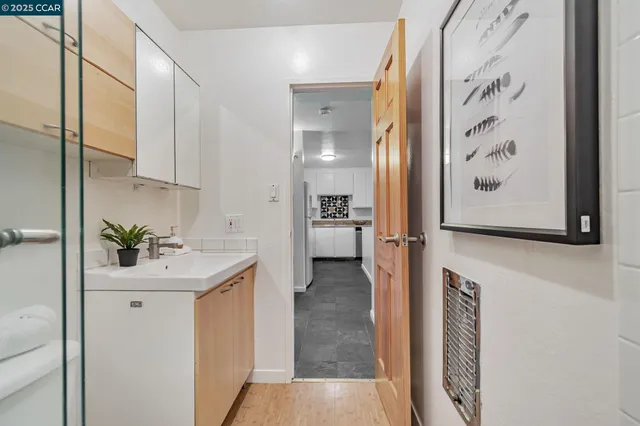 a kitchen with a sink and cabinets