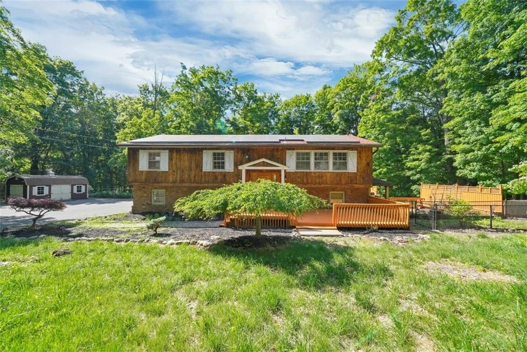 73 Dug Road Chester, NY 10918 - Photo 1 of 1 Bi-level home featuring a shed, a deck, and a front lawn