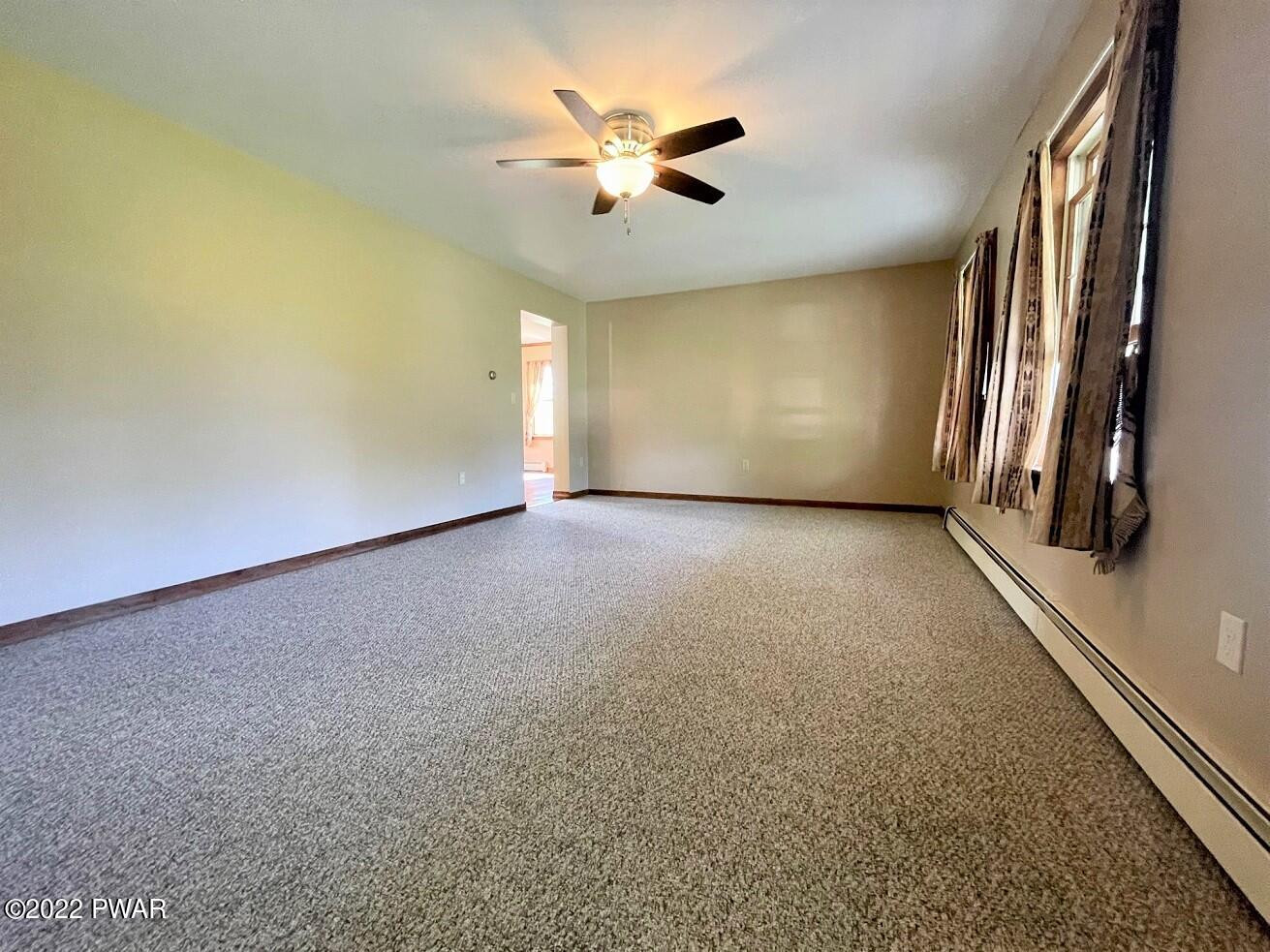 524 Creamton Drive Prompton, PA 18456 - Photo 22 of 57 an empty room with windows and cabinet