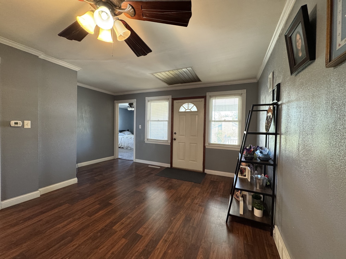 212 Mitchell Street Benton, IL 62812 - Photo 13 of 40 a view of empty room with wooden floor and fan