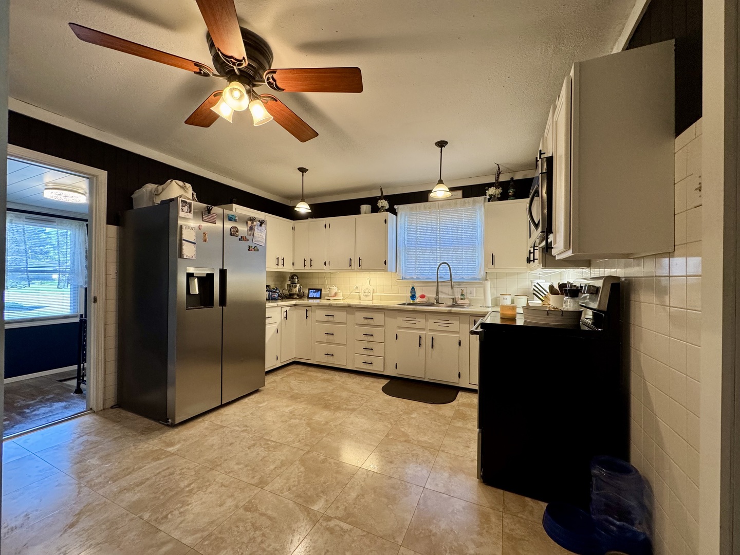 212 Mitchell Street Benton, IL 62812 - Photo 22 of 40 a kitchen with stainless steel appliances kitchen island granite countertop a refrigerator a sink and dishwasher