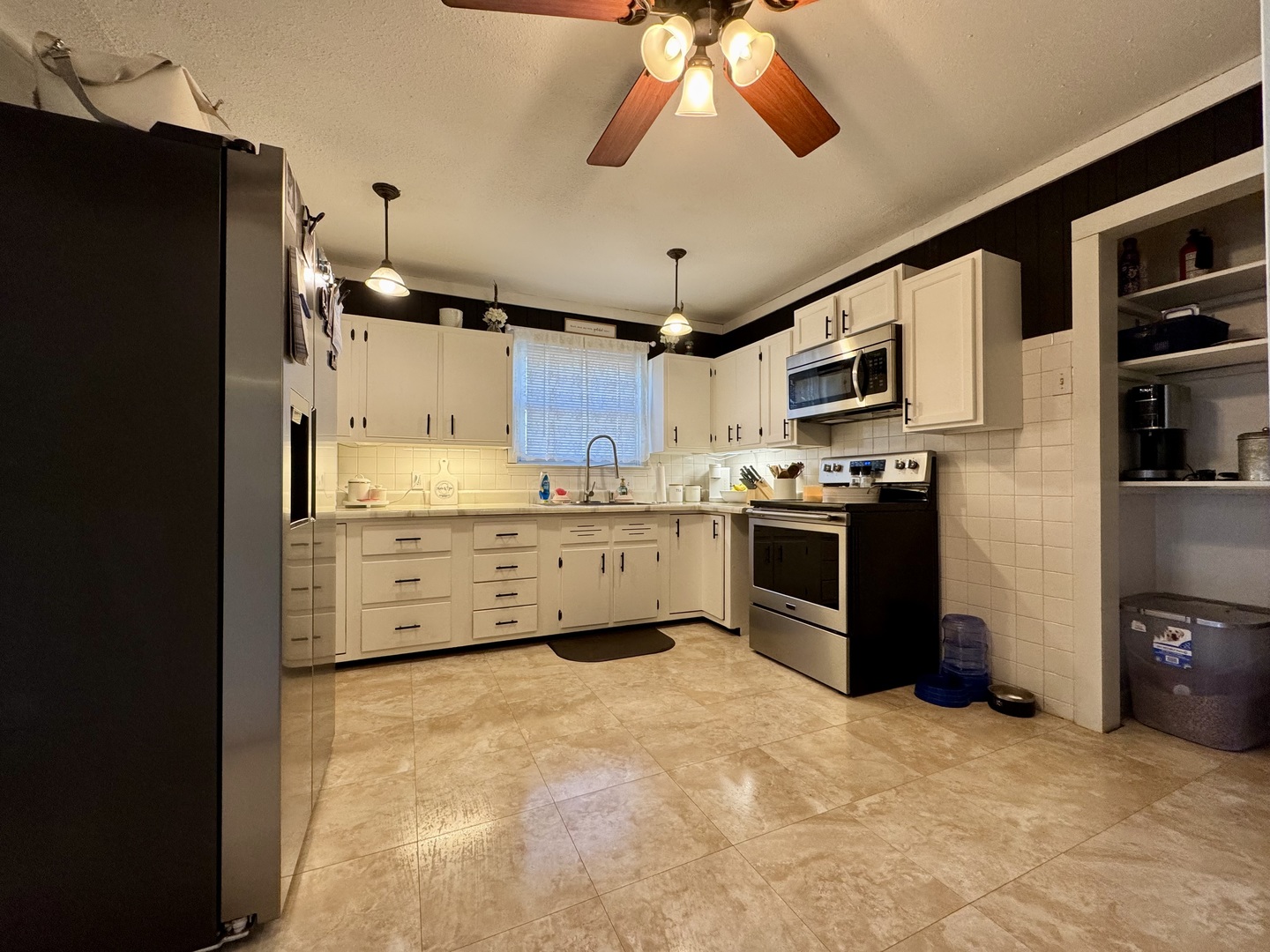 212 Mitchell Street Benton, IL 62812 - Photo 23 of 40 a kitchen with stainless steel appliances a refrigerator and a stove top oven