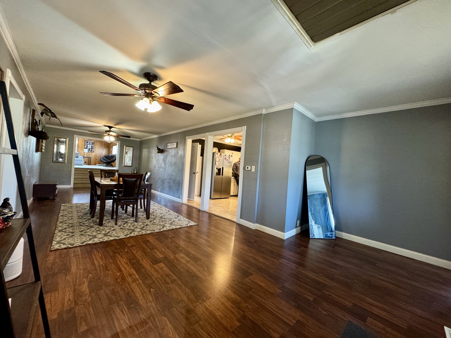 212 Mitchell Street Benton, IL 62812 - Photo 26 of 40 a dining room with wooden floor a chandelier a glass table and chairs