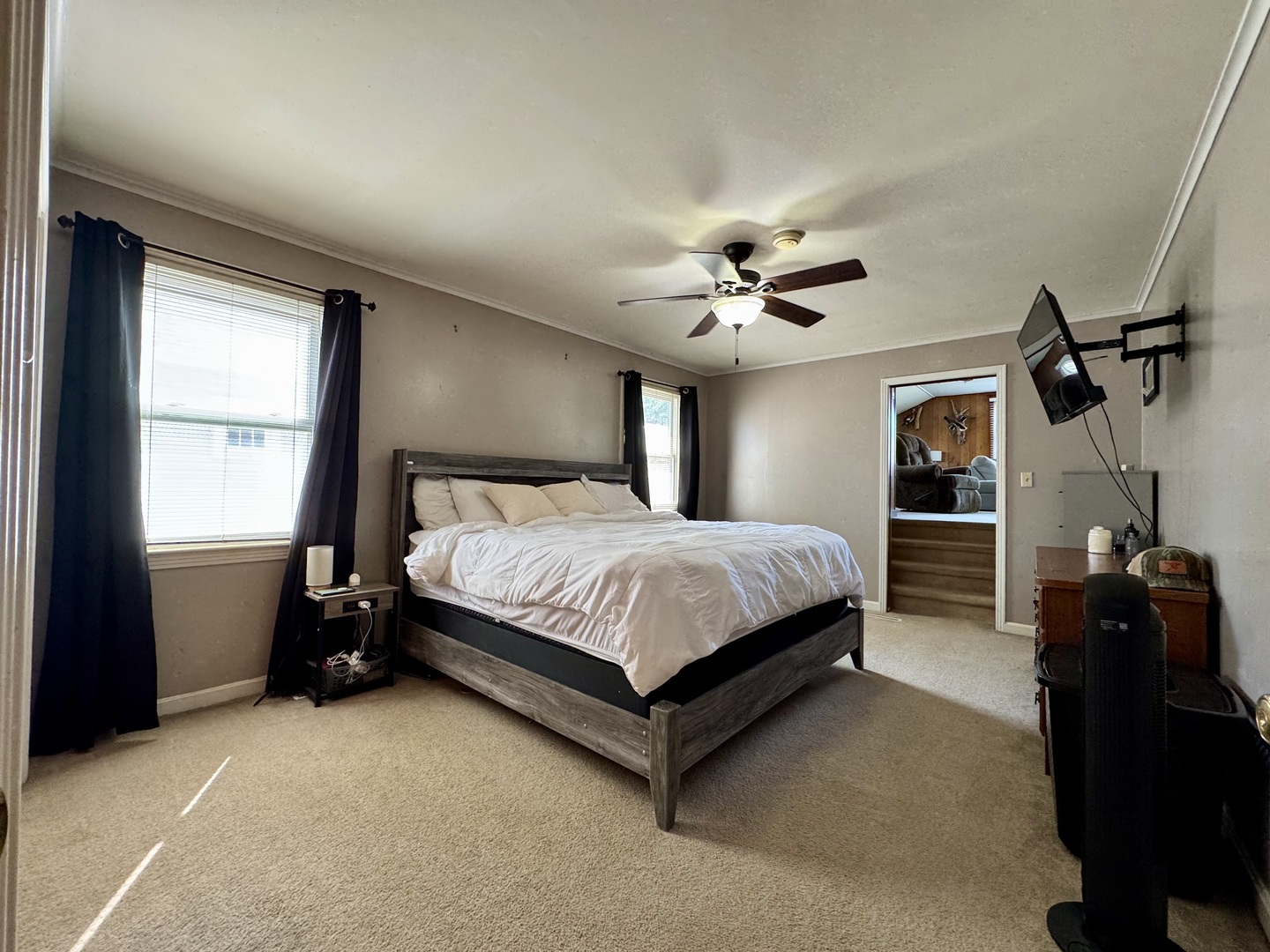212 Mitchell Street Benton, IL 62812 - Photo 29 of 40 a spacious bedroom with a bed and a chandelier