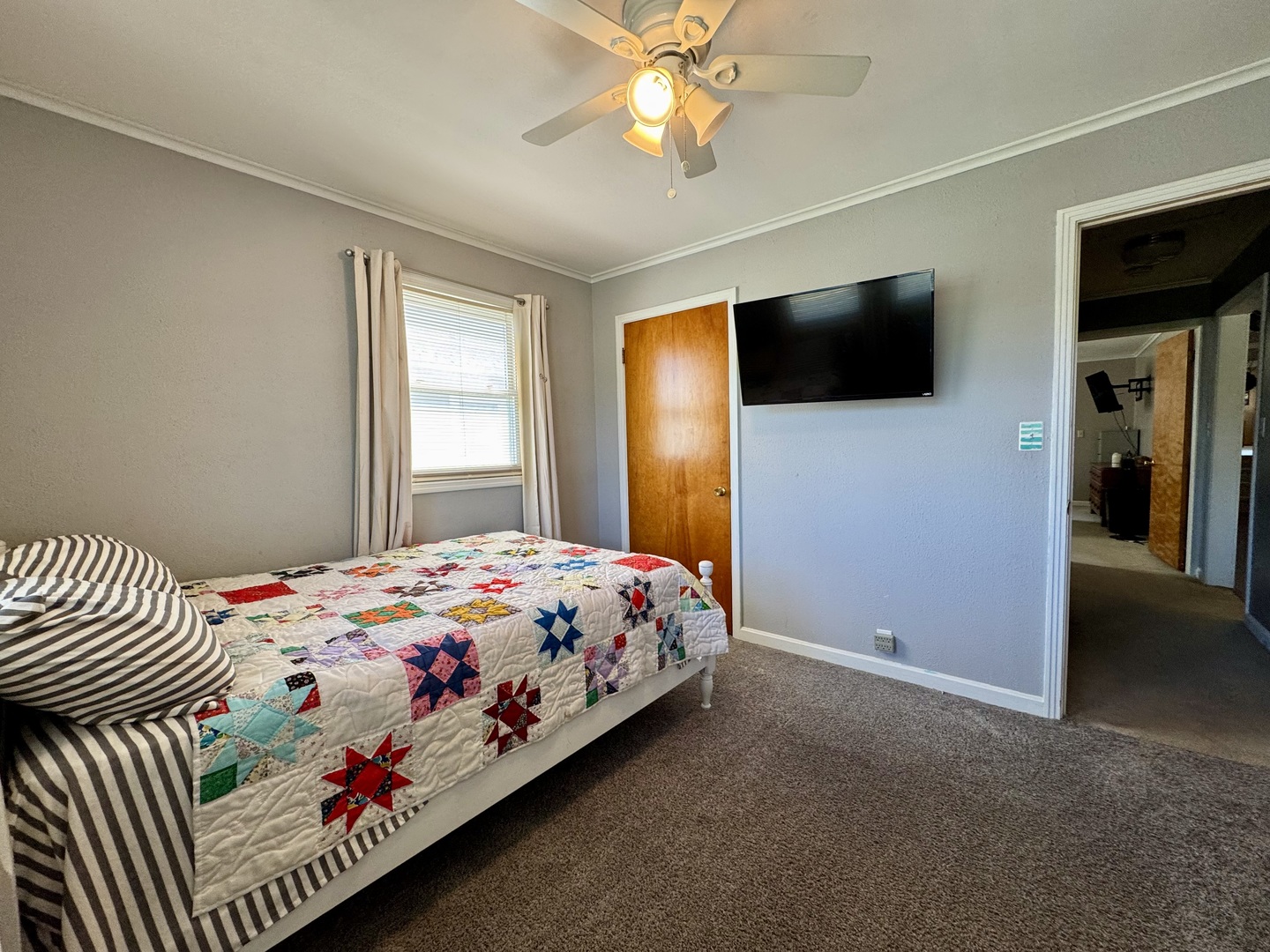 212 Mitchell Street Benton, IL 62812 - Photo 31 of 40 a bedroom with a bed and a flat screen tv