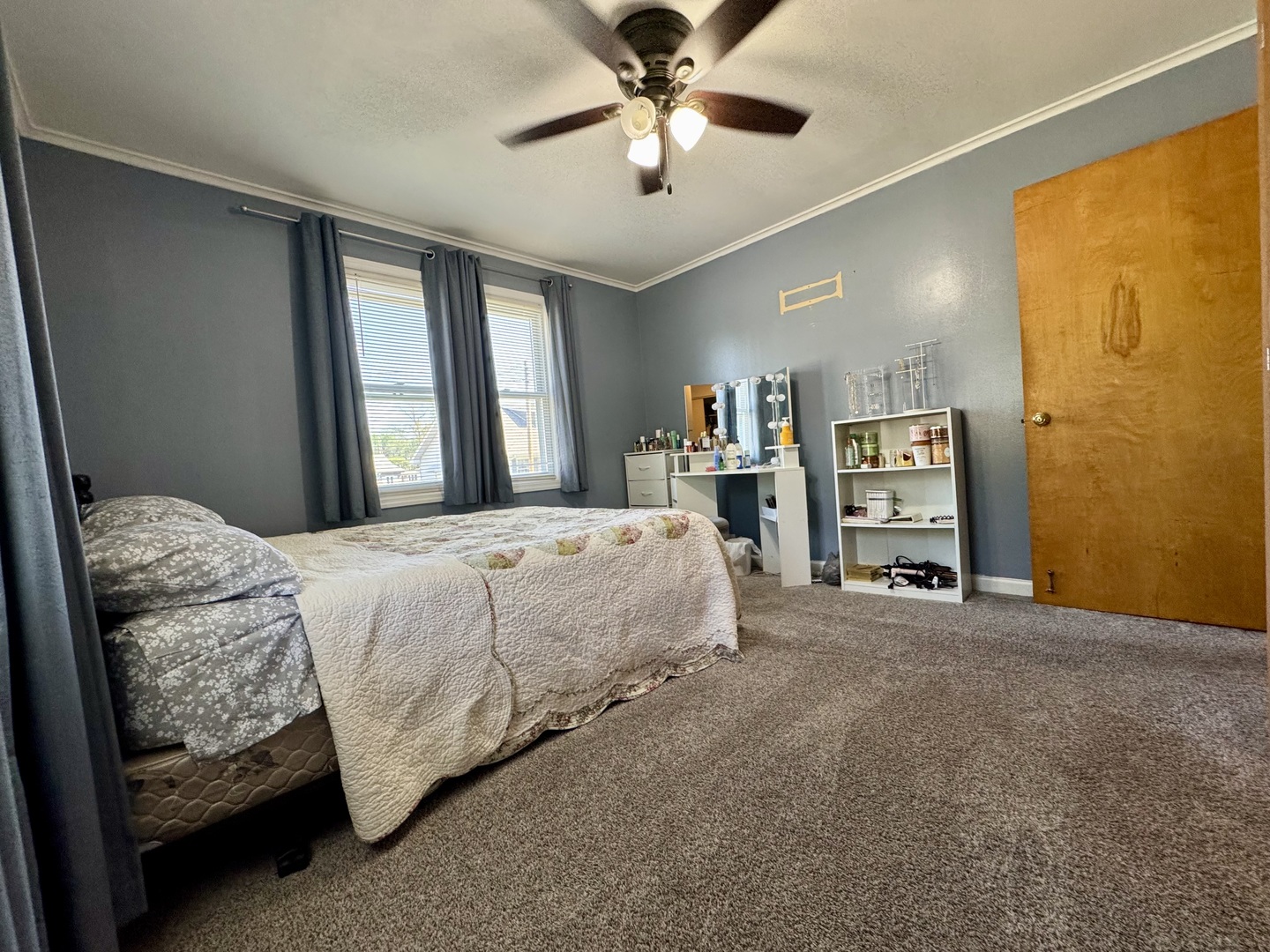 212 Mitchell Street Benton, IL 62812 - Photo 37 of 40 a spacious bedroom with a bed and a chandelier