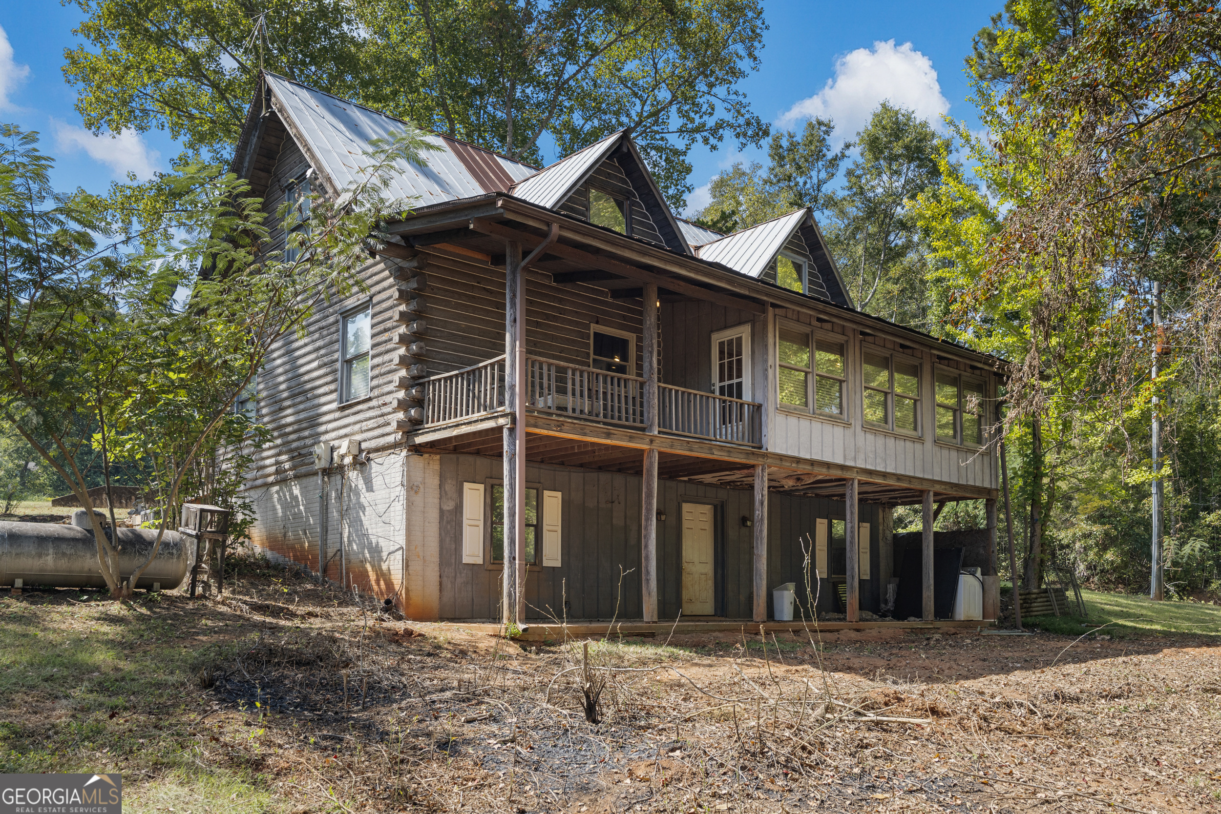 299 South L Street Hamilton, GA 31811 - Photo 1 of 36 a front view of a house with a yard