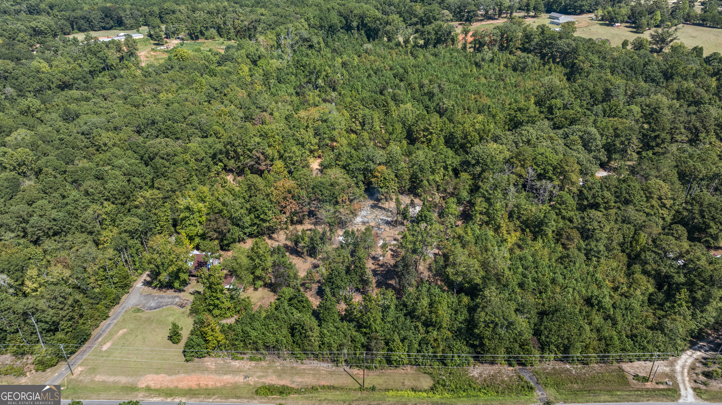 299 South L Street Hamilton, GA 31811 - Photo 11 of 36 an aerial view of a house with a yard