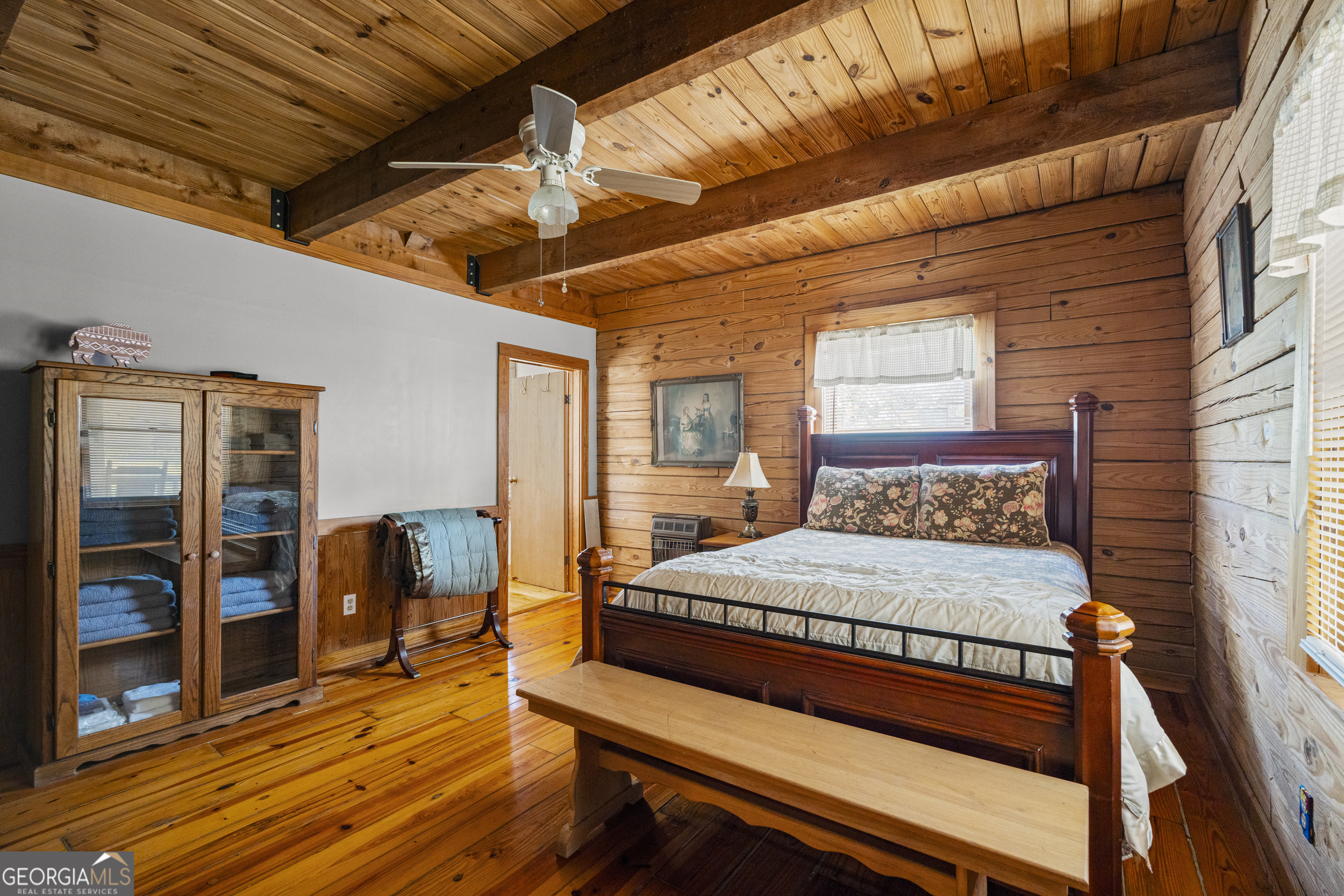 299 South L Street Hamilton, GA 31811 - Photo 17 of 36 a bedroom with a bed and wooden floor