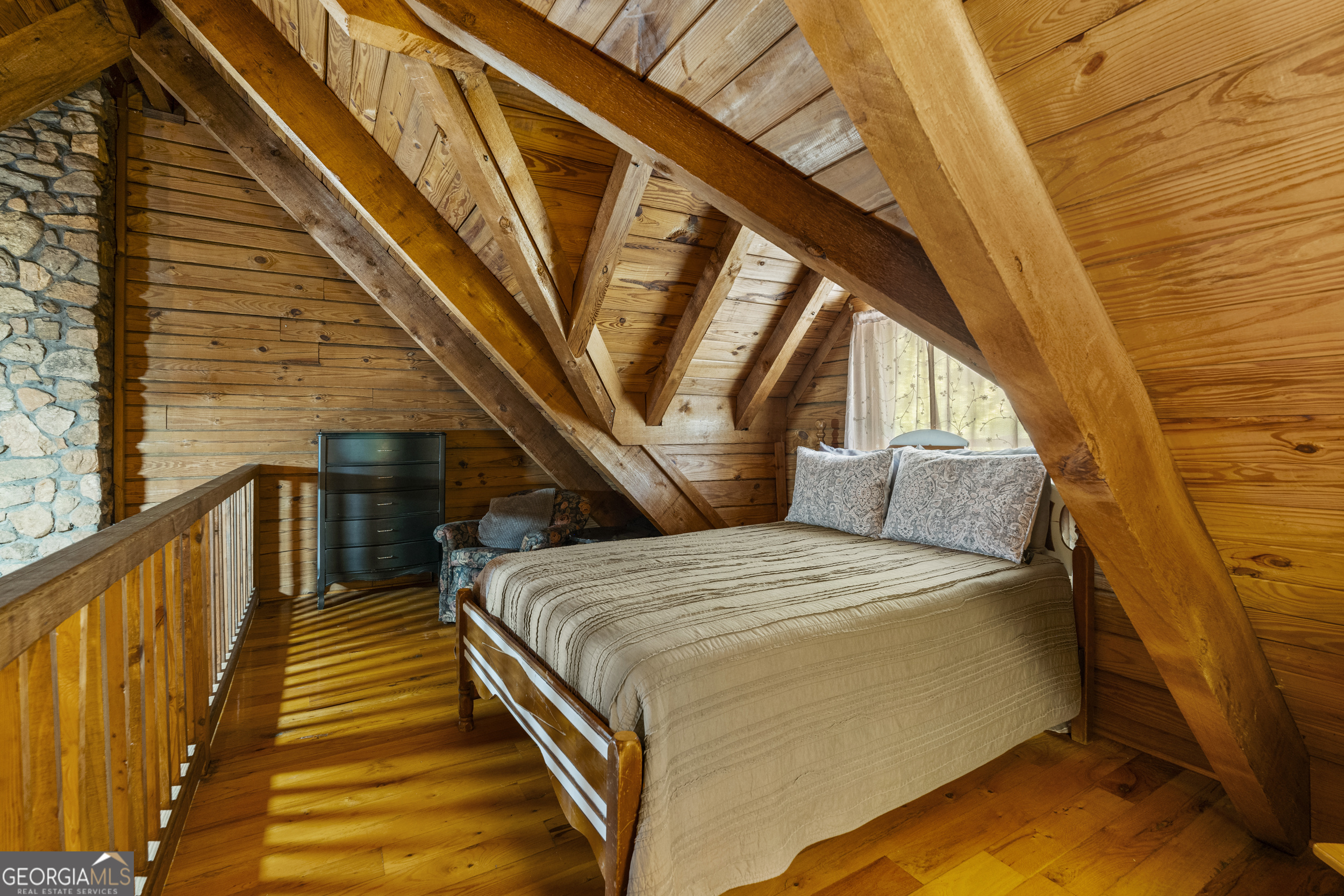 299 South L Street Hamilton, GA 31811 - Photo 19 of 36 a bedroom with a bed and balcony