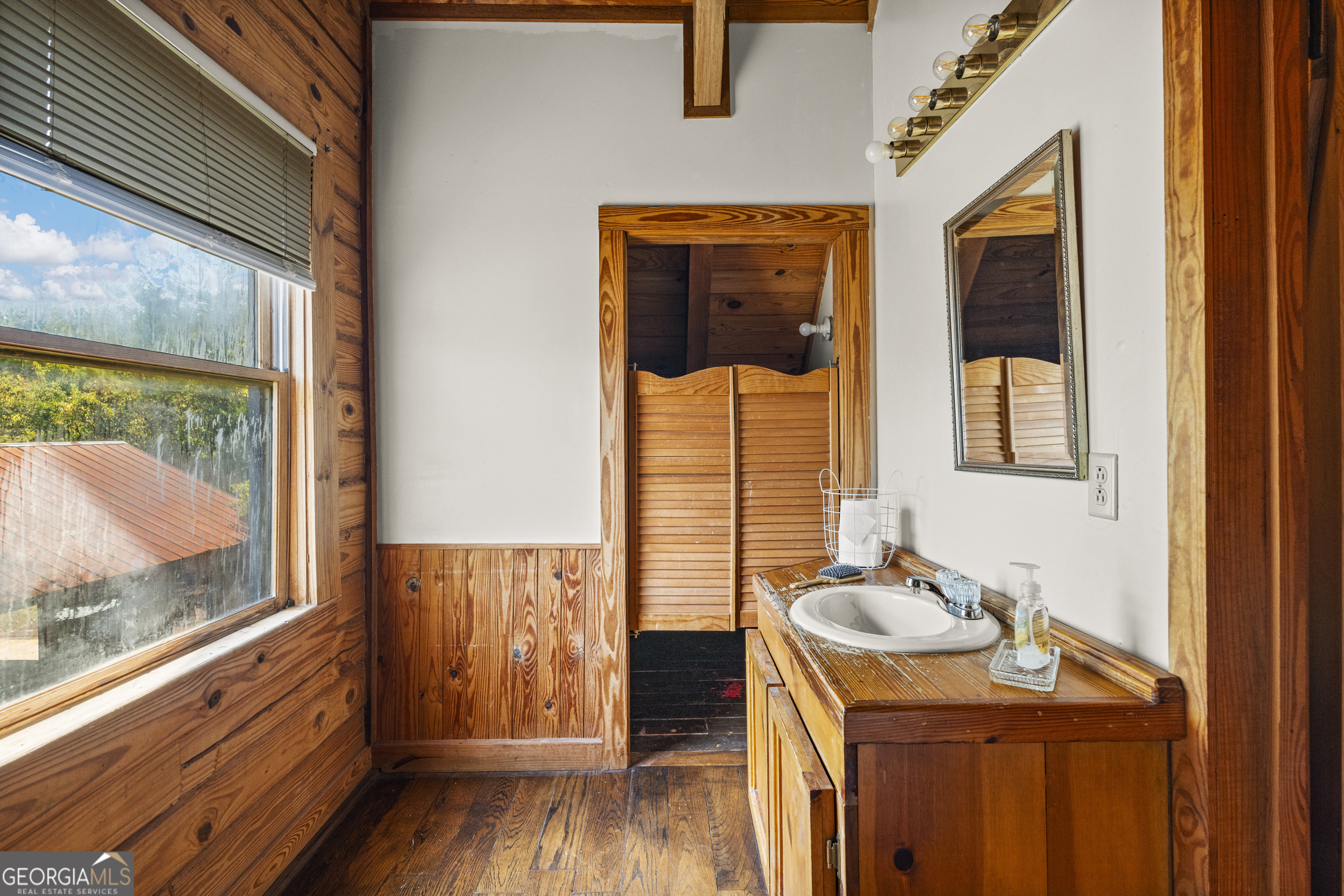299 South L Street Hamilton, GA 31811 - Photo 21 of 36 a bathroom with a sink and a window