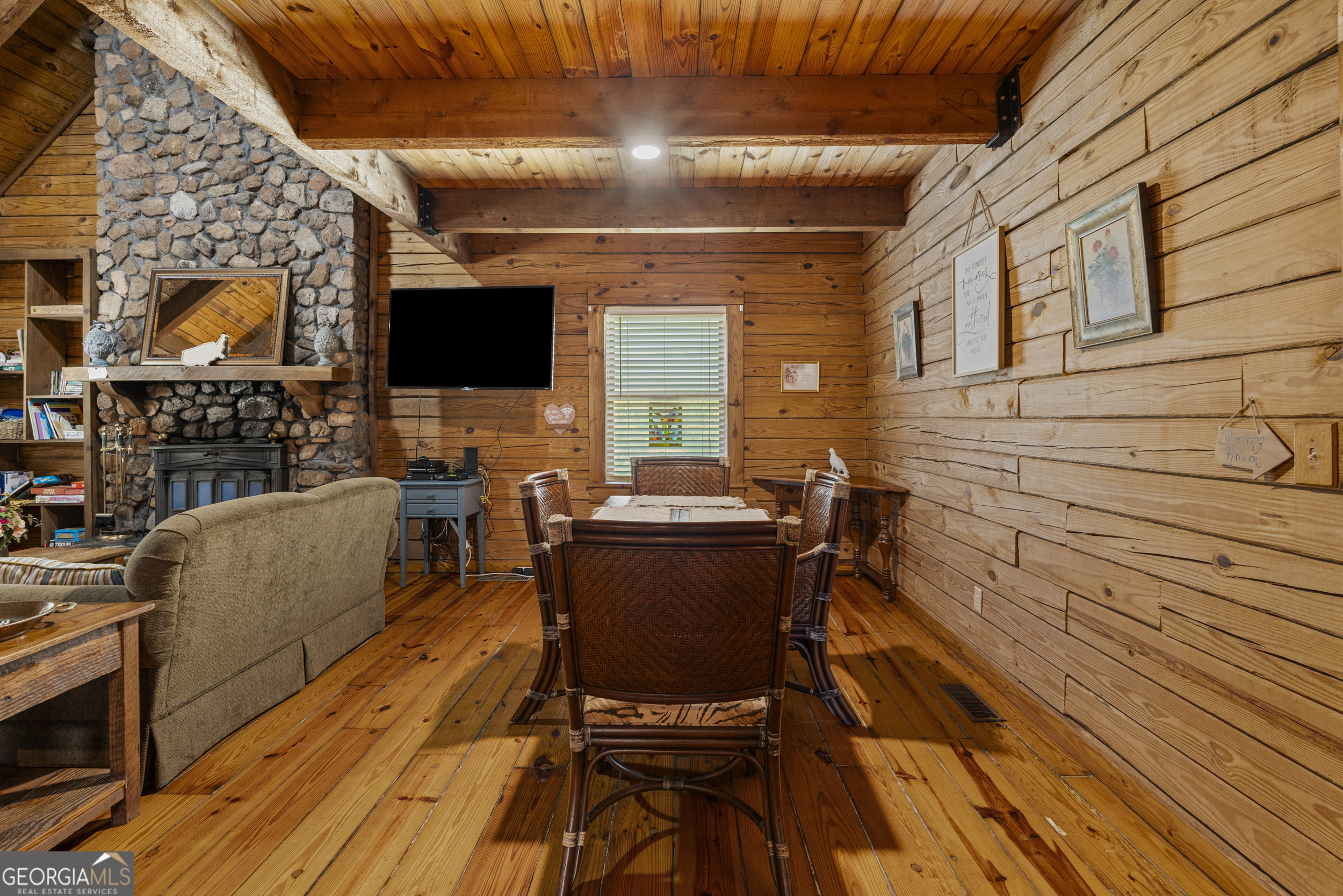299 South L Street Hamilton, GA 31811 - Photo 5 of 36 a view of a patio with table and chairs with wooden floor and fence