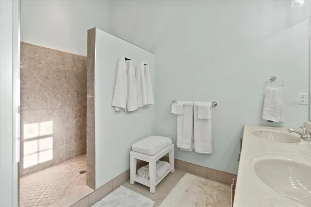 a white toilet sitting next to a bathroom sink