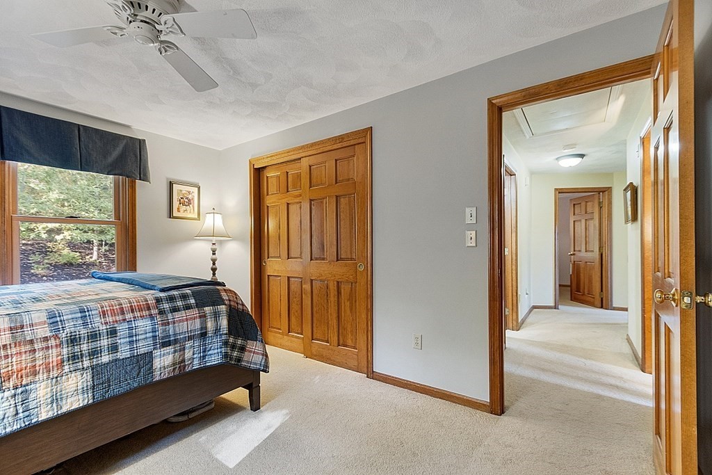 5 Abby Road Westford, MA 01886 - Photo 32 of 41 a bedroom with a bed and a window