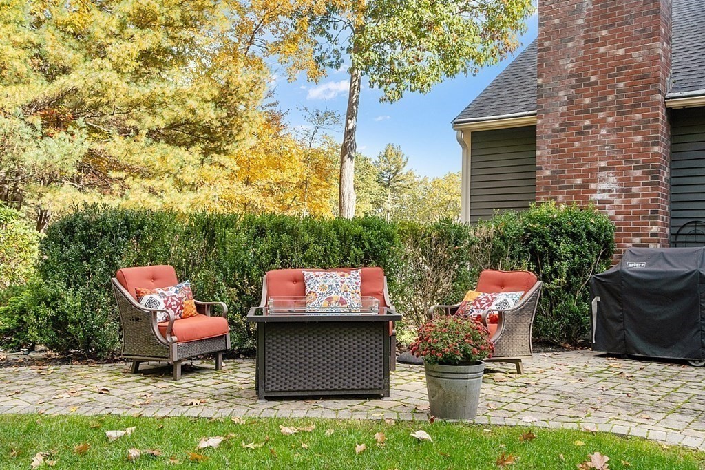 5 Abby Road Westford, MA 01886 - Photo 40 of 41 a table and chair sitting in backyard of a house