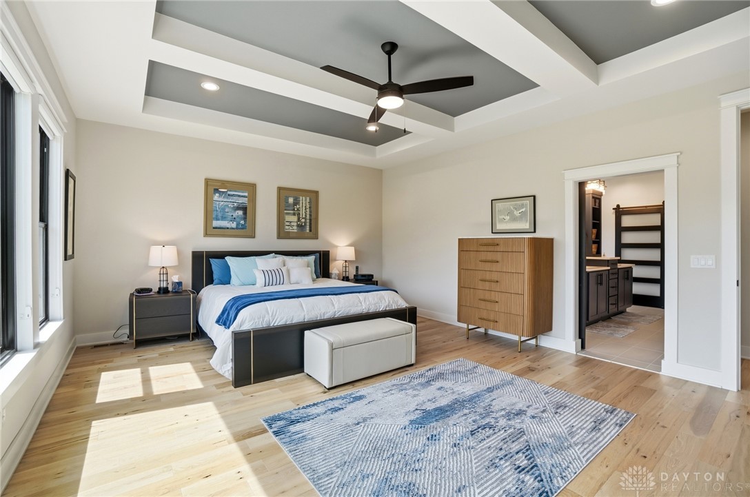 1247 Normandy Rue Dayton, OH 45458 - Photo 20 of 76 This spacious primary bedroom features beautiful hardwood flooring and elegant tray ceilings.
