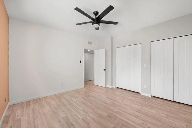 a view of a ceiling fan with wooden floor