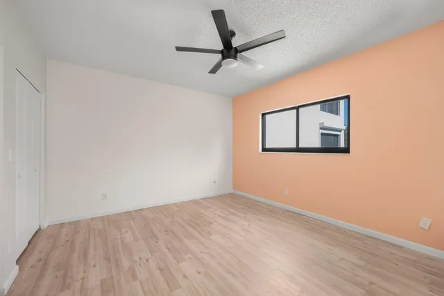 a view of swimming pool with outdoor seating and yard in the back