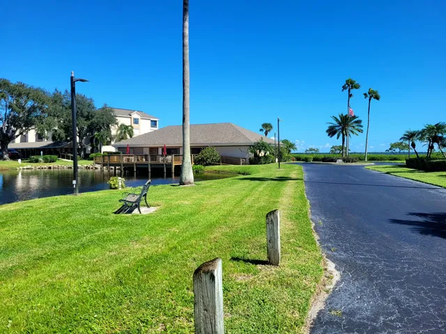 an aerial view of a house with a ocean view