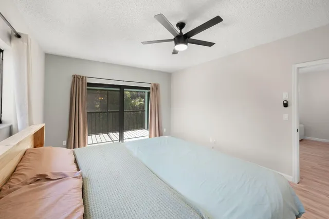 a bedroom with a large bed and a large window