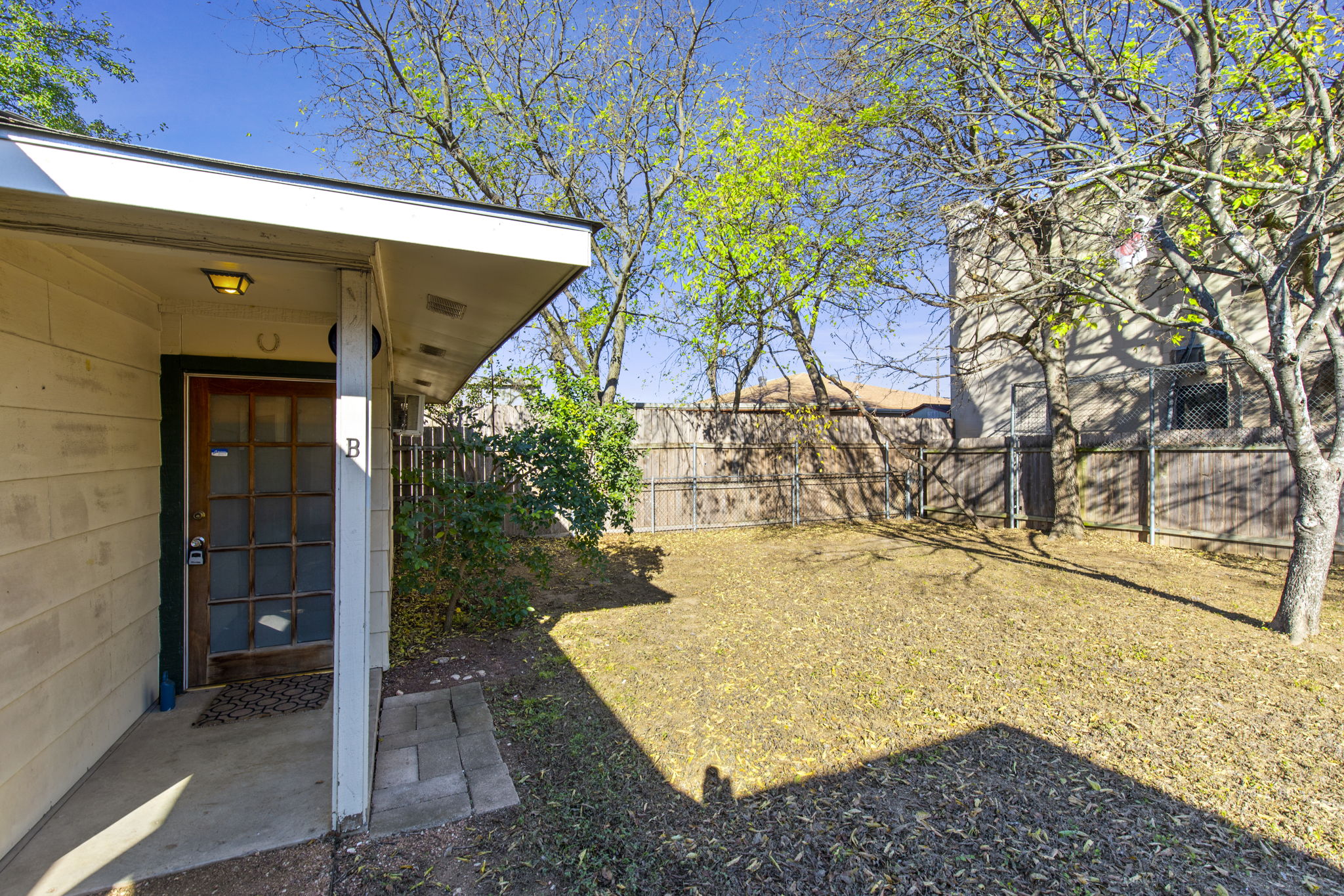7808 Watson Street, Unit B Austin, TX 78757 - Photo 2 of 12 a view of a backyard of the house