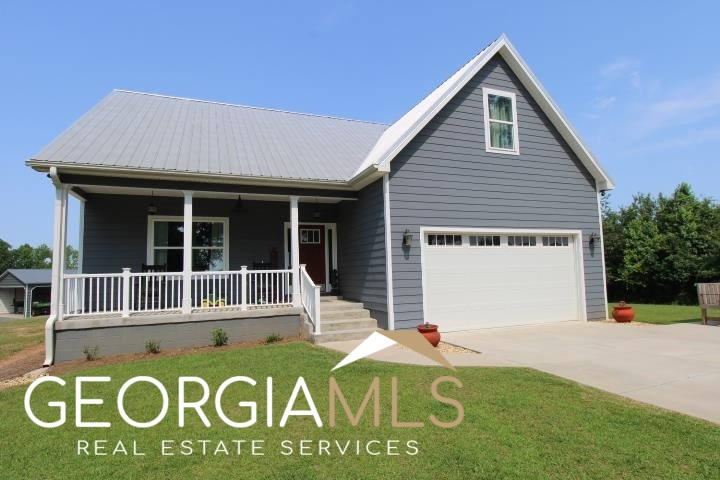 1358 City Pond Road Barnesville, GA 30204 - Photo 1 of 1 a front view of a house with a yard