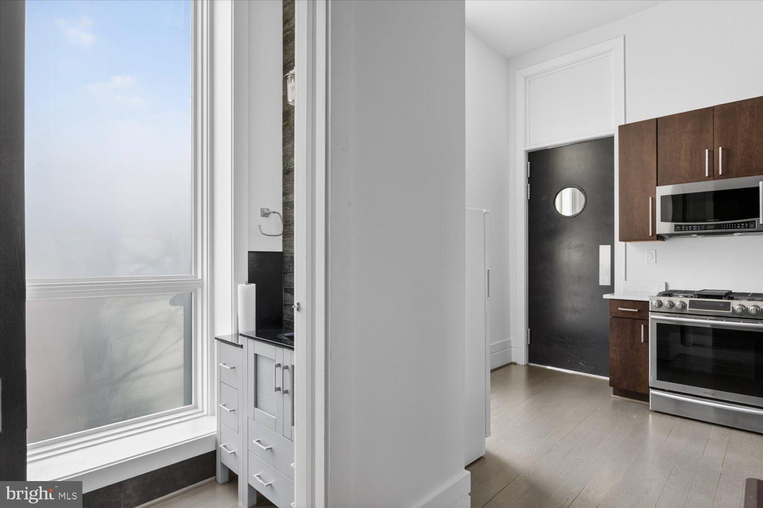 3017 Gates Road Northwest Washington, DC 20008 - Photo 22 of 92 1/2 bath in catering kitchen looking to dining