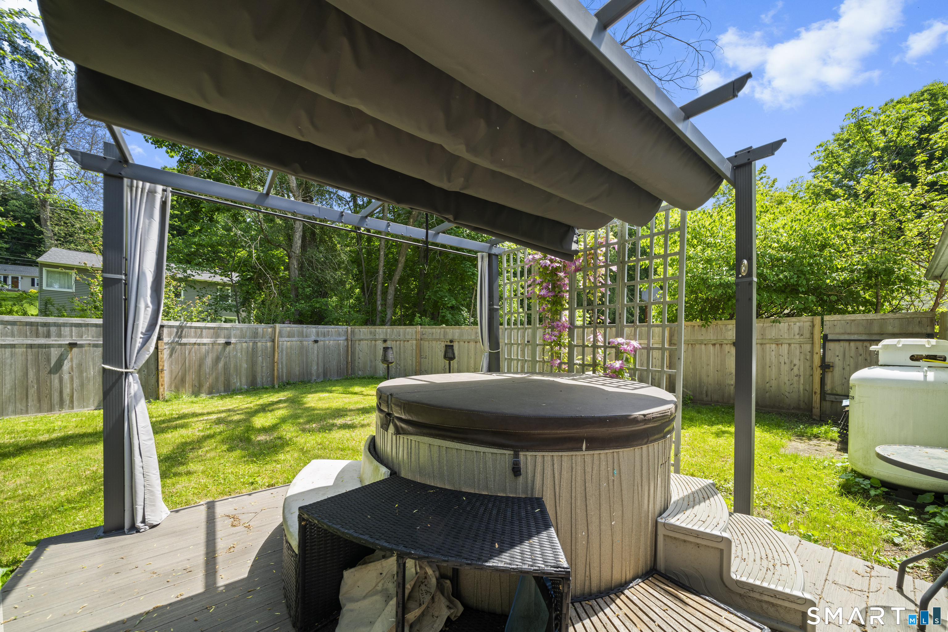 211 Whisconier Road Brookfield, CT 06804 - Photo 35 of 38 a view of a patio with a table chairs and a backyard