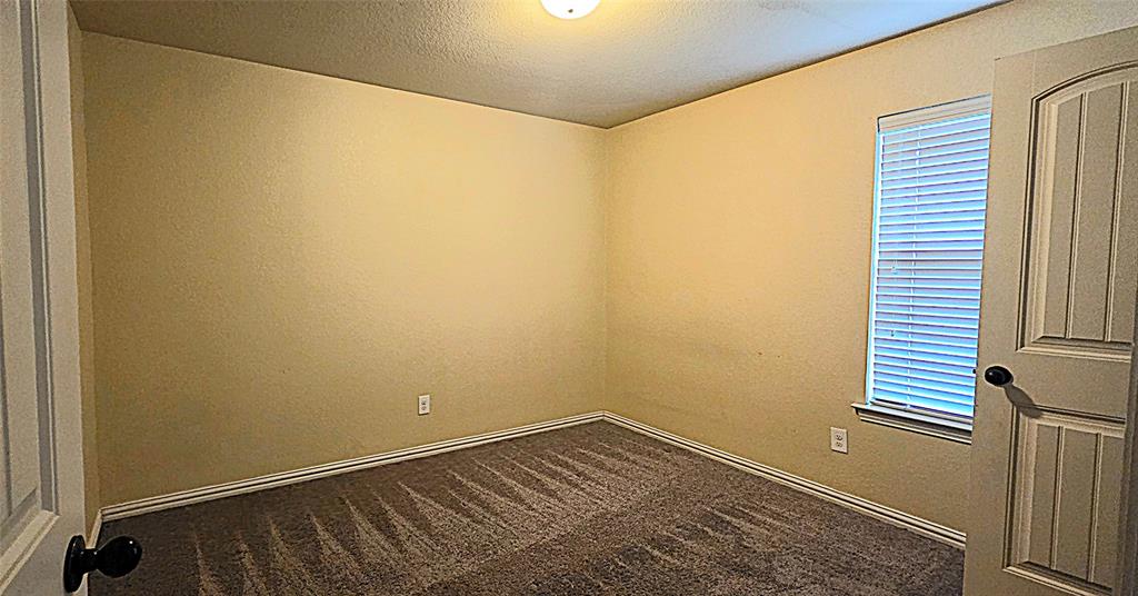 101 Hummingbird Drive Weatherford, TX 76085 - Photo 10 of 10 a view of a room with wooden floor and small space