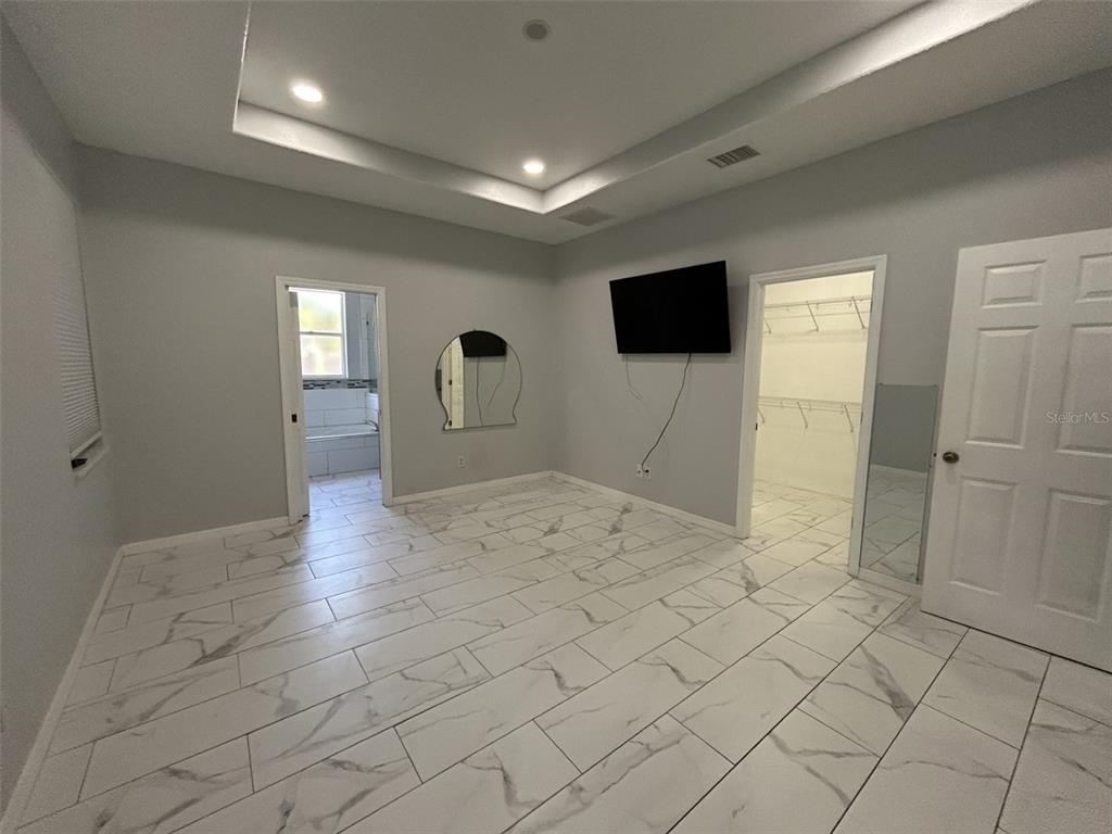 10439 Andover Point Circle Orlando, FL 32825 - Photo 19 of 33 a view of a livingroom with wooden floor and a window