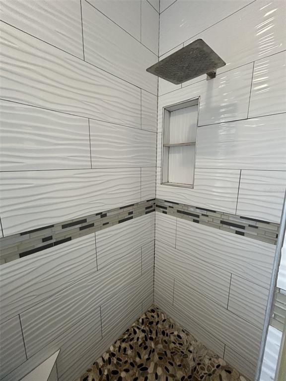 10439 Andover Point Circle Orlando, FL 32825 - Photo 24 of 33 a bathroom with a shower