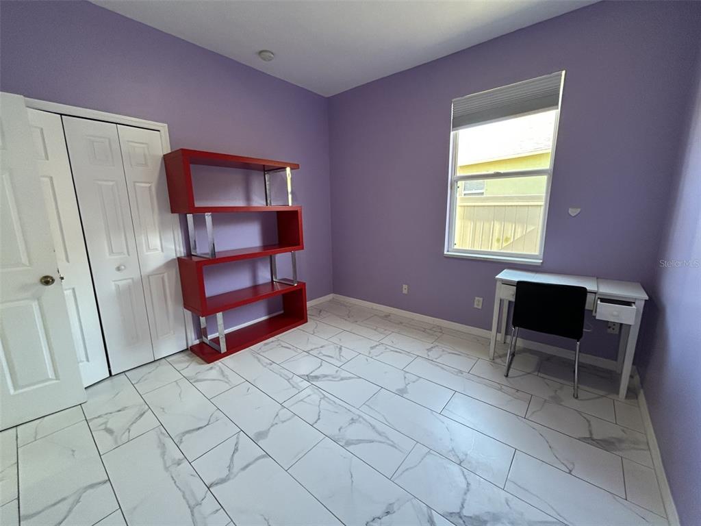 10439 Andover Point Circle Orlando, FL 32825 - Photo 26 of 33 a room with furniture and a window